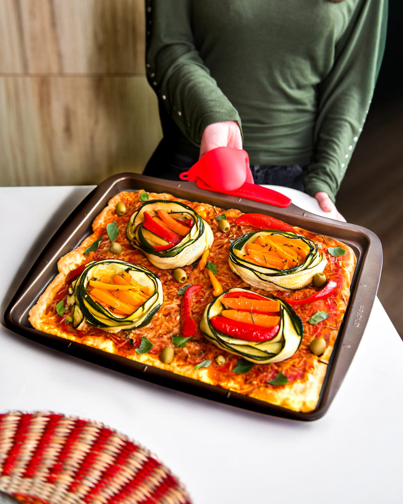Metal baking dishes and trays with silicone handles